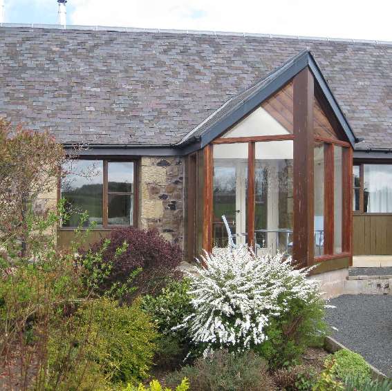 Begrum cottsge conservatory over looking cottage garden