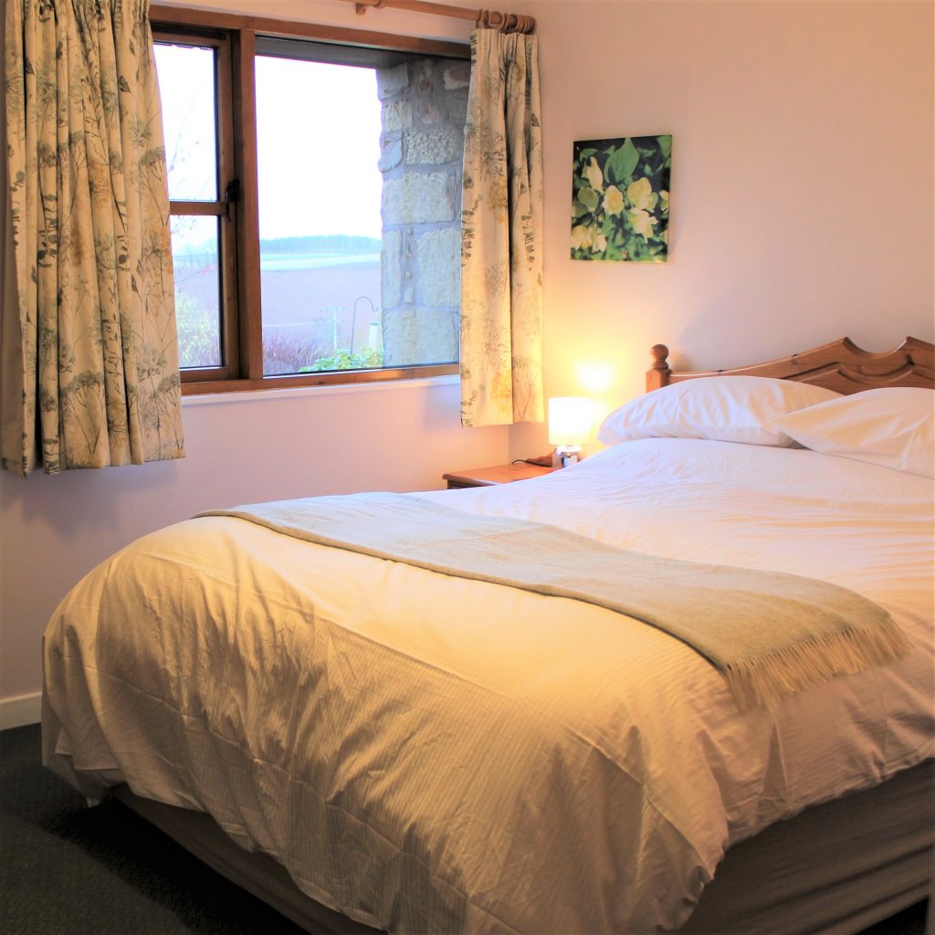 Thairn cottage has an extra long king sized bed. Wonderful views over cottage garden.