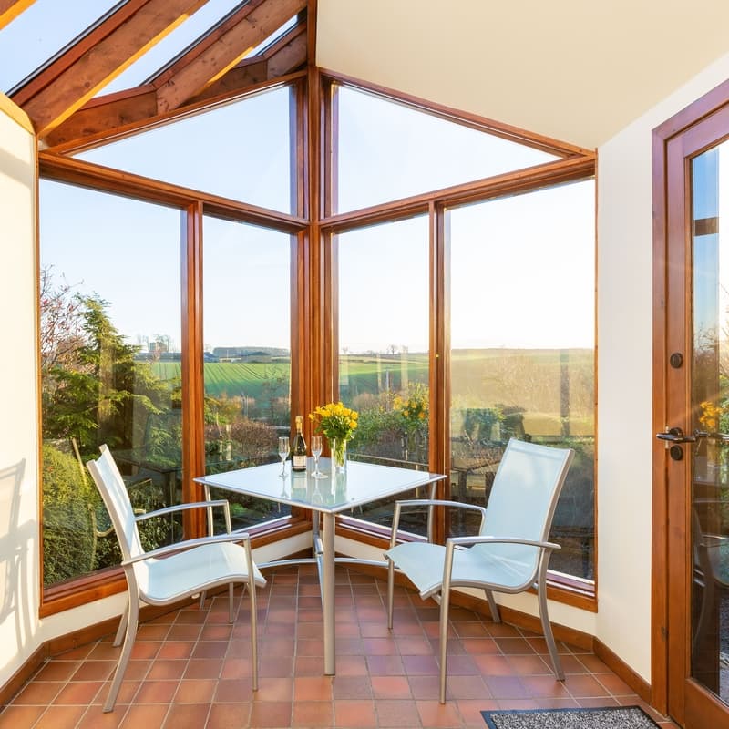 Mungo's well our cottage for couples sun room over looks Burnbrae Holidays cottage garden.