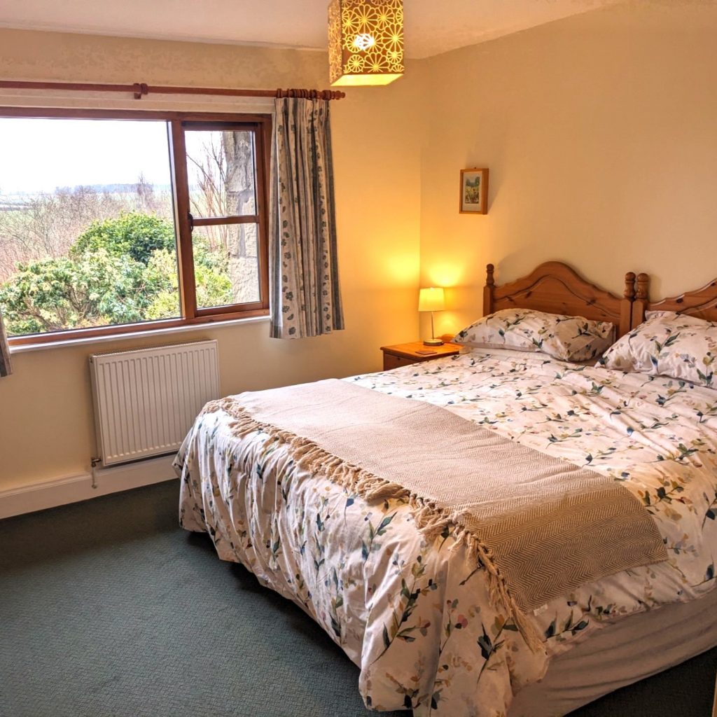 Mungo's Well  our cottage for couples, singles and friends bedroom has a superking bed which can be twin beds. Lovely views into the cottage garden. 