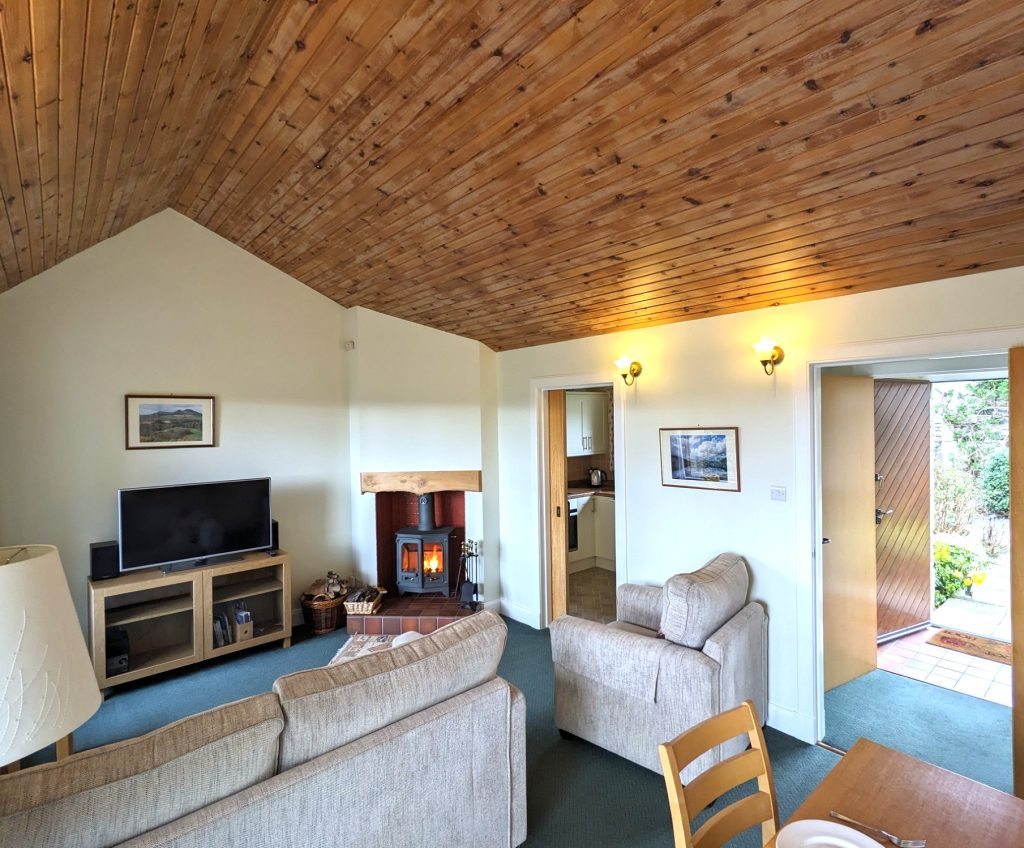 Begrum Cottage living room . Dog friendly , woodburning stove, Smart TV, wonderful views. 