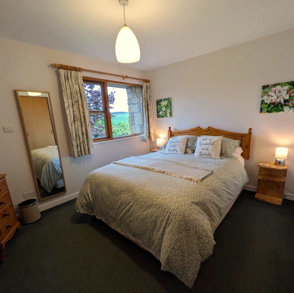 Thairn holiday cottage has an extra long king size bed, wonderful views into the garden. 