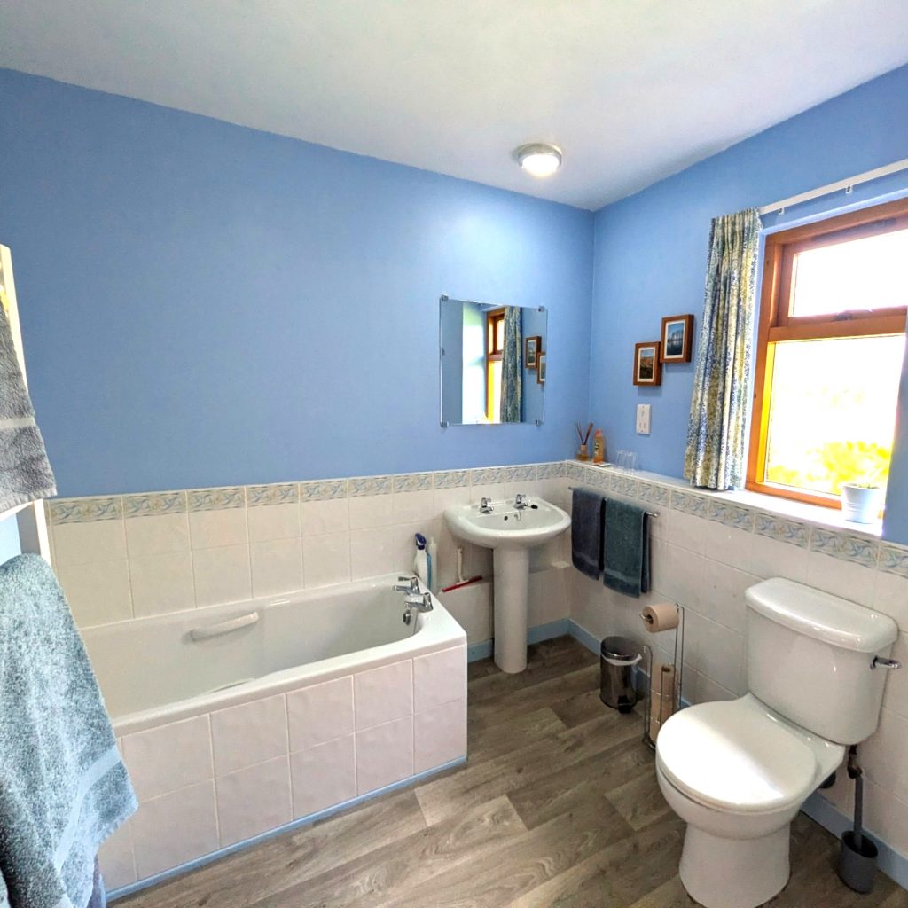 Thairn holiday cottage has a separate shower and bath in spacious, bright and clean bathroom.