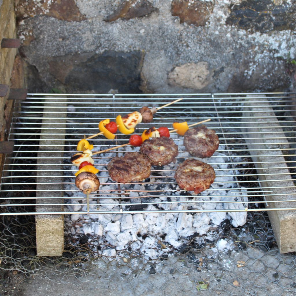 Food cooking on a BBQ at Burnbrae Holidays